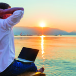 freelancer working by the beach