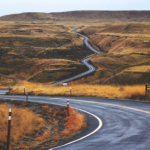 Windy road surrounded by yellow hills